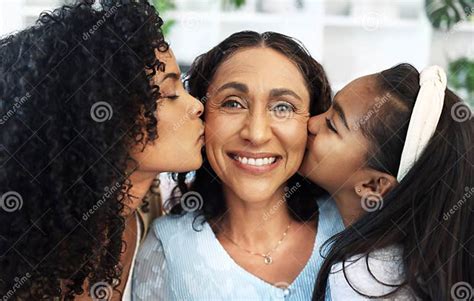 Portrait Kiss On The Cheek For A Senior Woman With Her Daughter And