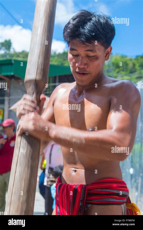 Man From Ifugao Minority In A Rice Pounding Competion During Imbayah