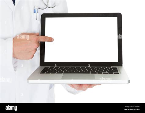 Happy Male Doctor Showing On Laptop Over White Background Stock Photo