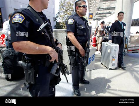 Los Angeles Airport Police Officers Stand In Front Of The Tom Bradley