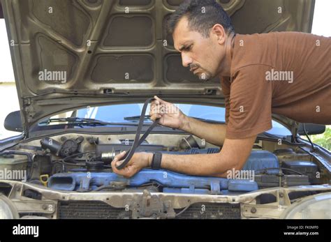 Man Trying To Repair Your Own Car Stock Photo Alamy