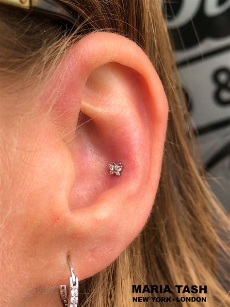 Fresh Conch Piercing With A Jewelry From The Brand Maria Tash The Diamond Butterfly Conch