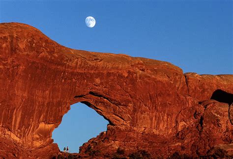 North Window Arches National Park With The Moon And 2 Hikers Photograph