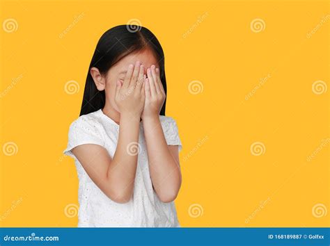 Little Caucasian Child Girl Closing Hid Eyes By Hand Isolated Over
