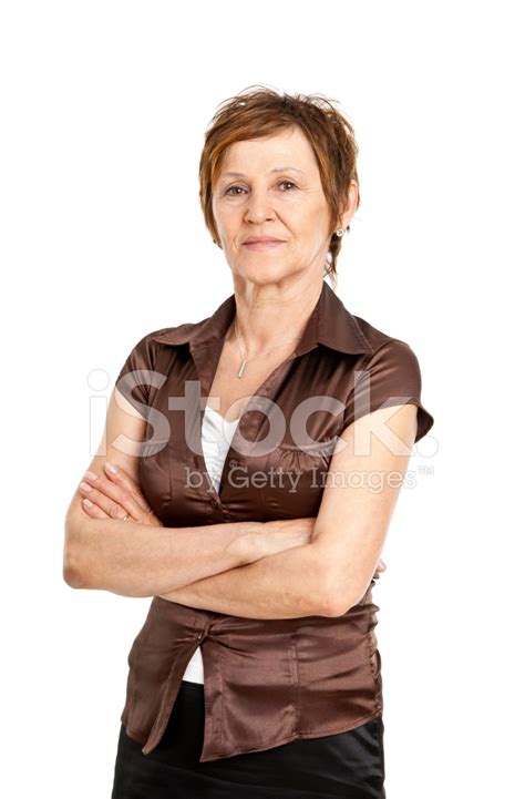 Mature Woman Standing With Arms Folded Stock Photo Royalty Free