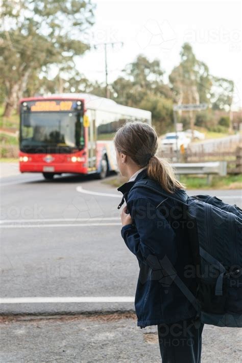 Image Of School Girl Waiting For The Bus Austockphoto