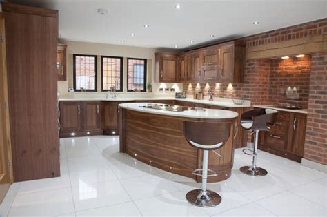 A clear varnish was used to protect and provide a clean gloss finish. Dark Wood Modern Kitchen - Walnut | Bespoke Kitchens