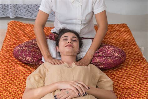 Concept Thai Massage Beautiful Asian Woman Getting Thai Herbal Massage In Spa Salonthai Girl