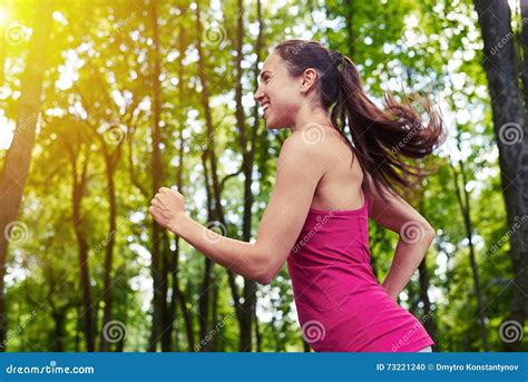 Fit Girl Jogging In The Park On Sunny Day Stock Photo Image Of Close