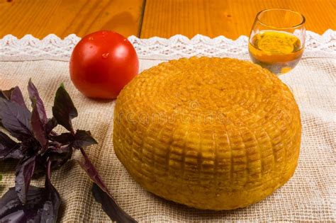 National Adyghe Cheese Homemade On A Woven Cloth With Basil Tomato Sesame Oil Chili Pepper