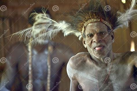 Portrait Of A Man From The Tribe Of Asmat People With Ritual Face