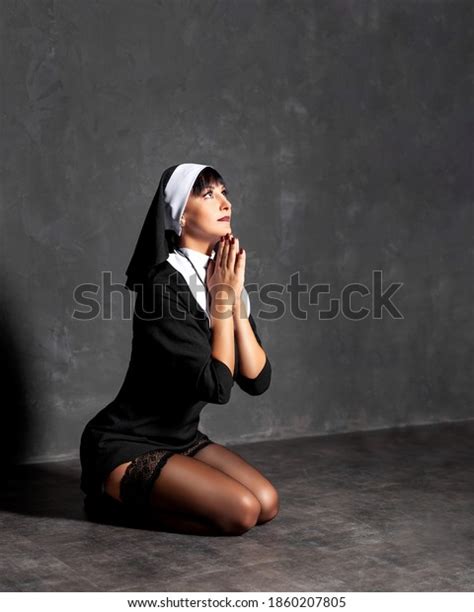 sexy nonne betet auf dem boden stockfoto 1860207805 shutterstock