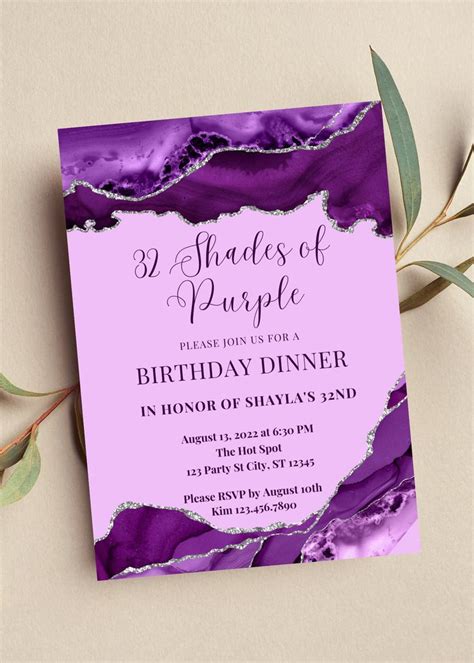 a purple marble birthday party card on a table