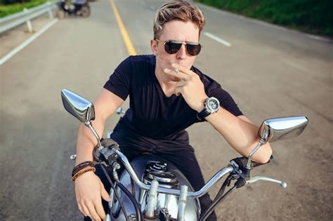 Premium Photo Portrait Of A Guy Sitting On A Motorcycle