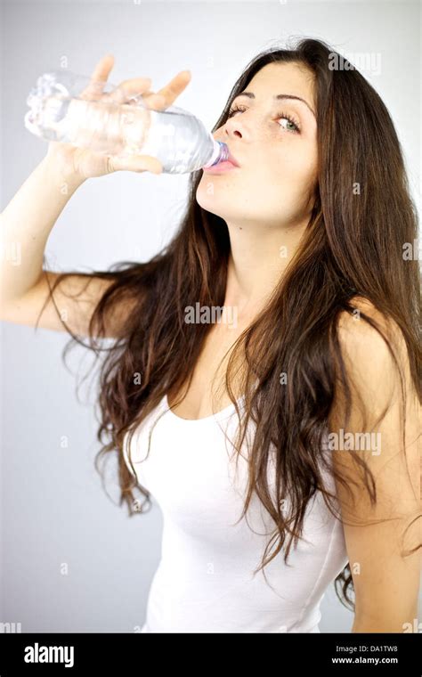 Gorgeous Female Model Drinking Water From Bottle Thirsty Stock Photo