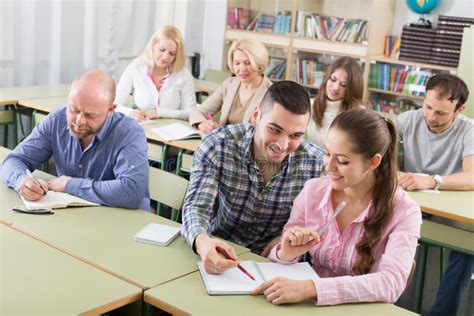 Adult Students Writing In Classroom Stock Photo Image Of Interior
