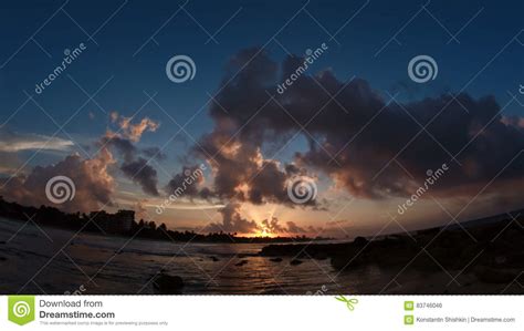 Sunset Over Sea Caribbean Tropical Waterfront In Clouds Stock Photo