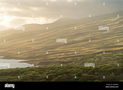 Maui's Piilani Highway unveils a breathtaking view of sun-kissed hills
