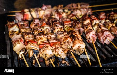 Grilling Meat Skewers On Natural Charcoal Barbecue Grill Preparing A