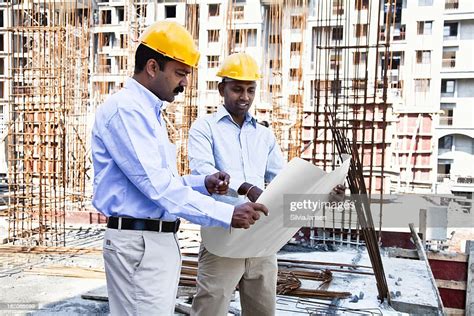 Indian Engineer Architect On Construction Site High Res Stock Photo