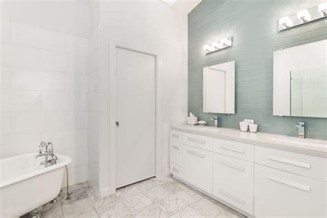 White Master Bathroom With Blue Accent Wall Hgtv