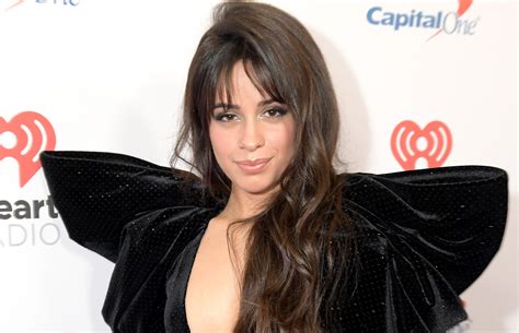 camila cabello shows off her rear to the fullest in a string micro thong posing on the beach