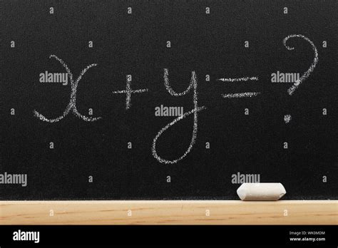 Mathematical Equation Written On A Blackboard By A Chalk Stock Photo