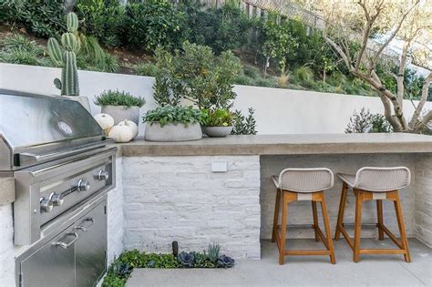 White Brick Outdoor Kitchen With Concrete Countertop