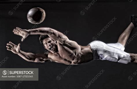 Portrait Of Athlete Justin Hook Catching A Football Bodies In Action