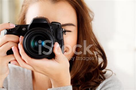 Pretty Woman Is A Professional Photographer With Dslr Camera Stock