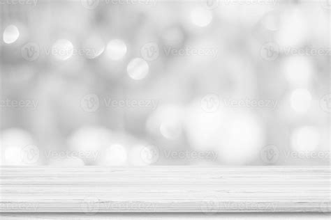 White Wooden Table Top Background Over Blur Bokeh Light For Product