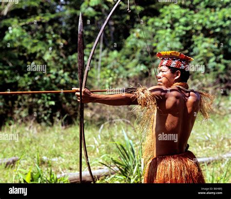 Indian Indio Or Indigenous Warrior Pointing A Bow And Arrow Amazon