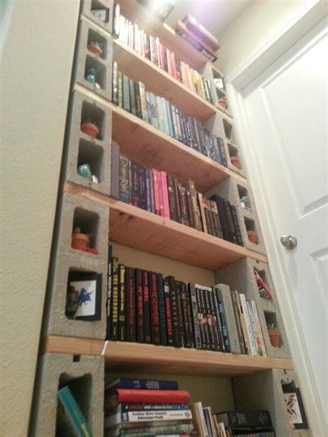 DIY cinder block bookshelf! It only costs 40$ bucks to make. Totally
