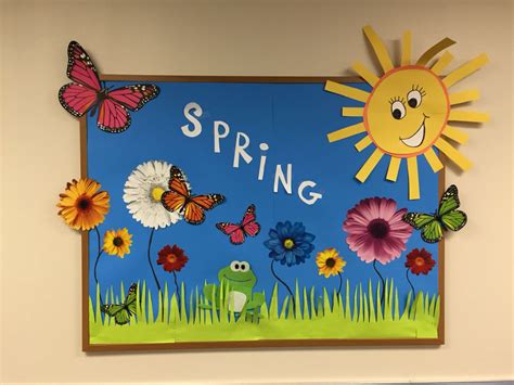 A Bulletin Board With Flowers And Butterflies On It That Says Spring In