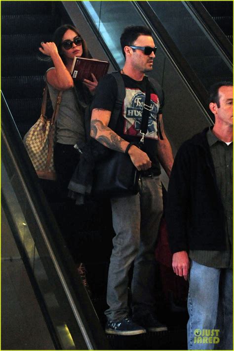 Megan Fox And Brian Austin Green Book Carrying Lax Departure Photo
