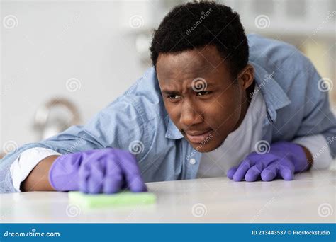 Concentrated Black Guy House Keeping Attendant Cleaning Table Stock Image Image Of Lifestyle