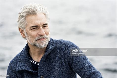 Mature Grey Haired Man Wearing Blue Sweater Photo Getty Images