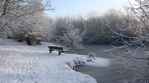 Download Wallpaper 1920x1080 Bench Winter Snow Traces Lake Ice