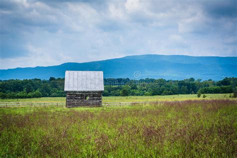 Small Shed In A Farm Field And Distant Mountains In The Rural Sh Stock