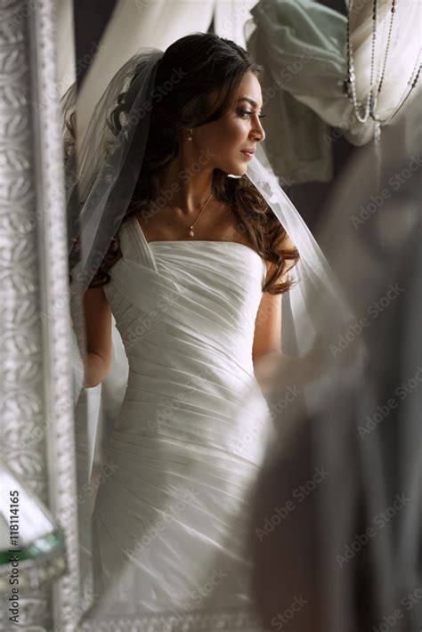 Beautiful Slim Bride In The Elegant Classic White Wedding Dress With