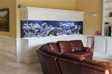 A Living Room Filled With Furniture And An Aquarium