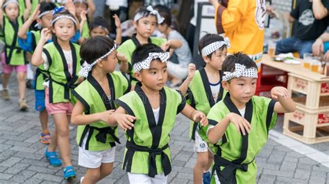 Japanese Children Dancing Traditional Awaodori Dance In The Famous