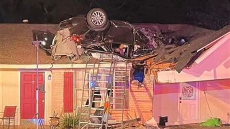 Vehicle Becomes Airborne After Hitting Tree And Lands On Roof Of