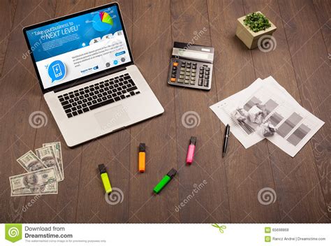 Laptop On Office Desk With Business Website On Screen Stock Photo