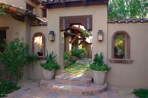 A path connects the tower to the prison cells, creating a path between torture sites. Scottsdale home entry | Spanish style, Hacienda style