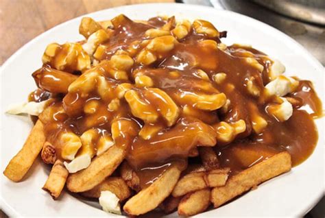 Poutine French Fries And Cheese Curds Topped With Gravy Chowcation