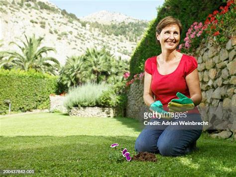 Mature Woman Kneeling Photos And Premium High Res Pictures Getty Images
