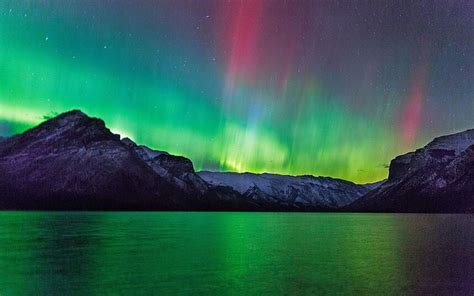 The Aurora Borealis Over The Canadian Rocky Mountains Courtesy Of The