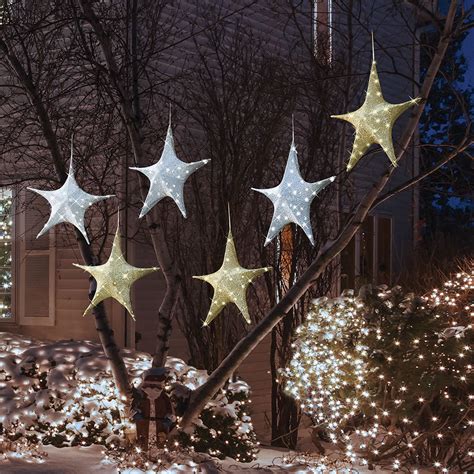 The Cordless Outdoor Twinkling Tree Stars Hammacher Schlemmer