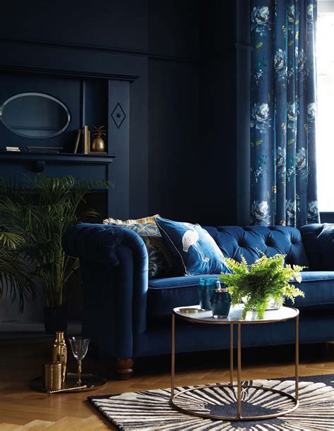 Navy Blue Velvet Sofa And Navy Walls In A Living Room Velvet Sofa